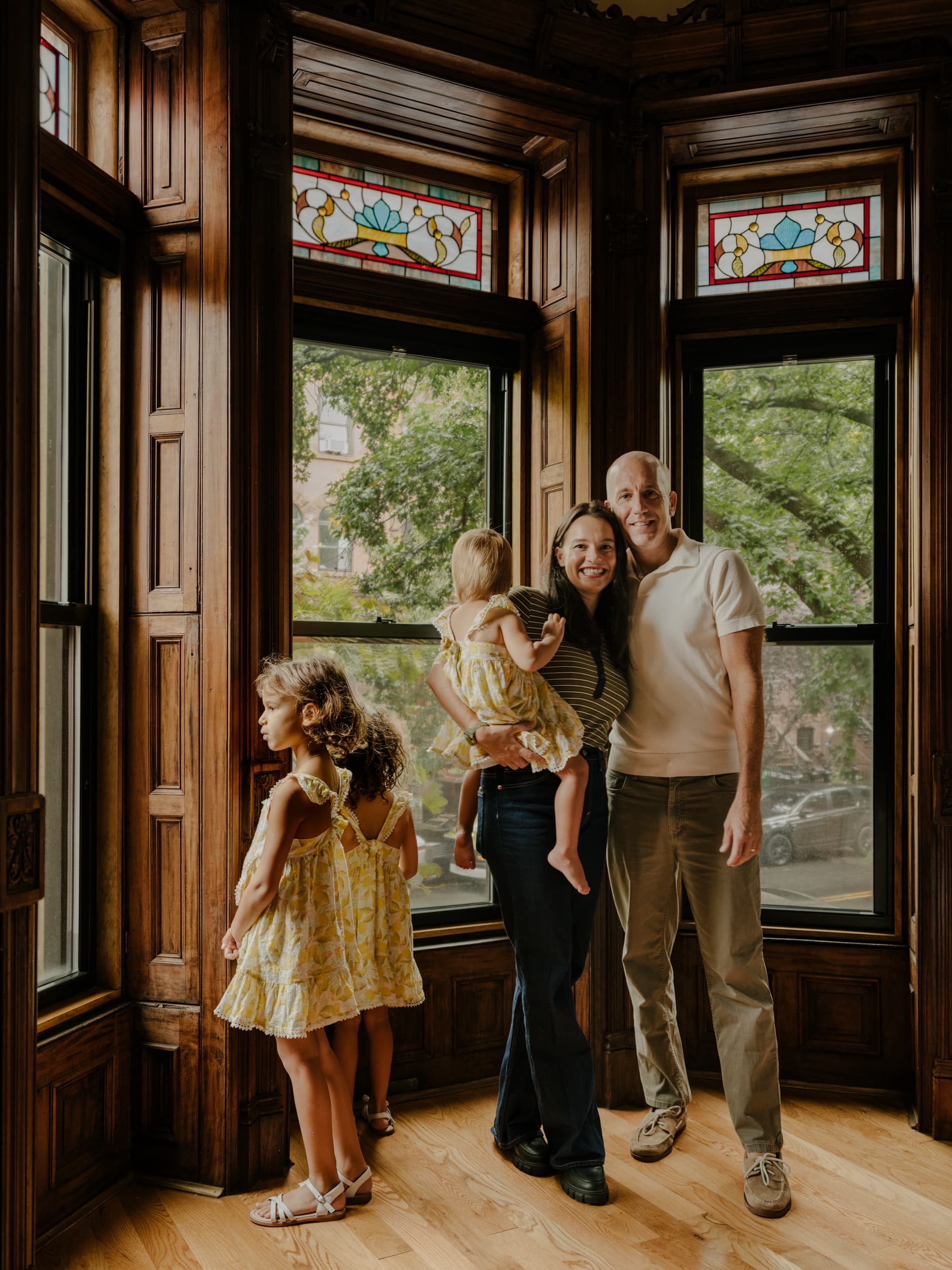 James and Laureta with their children in a bay window at Halsey